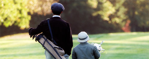 Francis Oumet con su inseparable caddie, Eddie Lowery